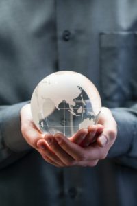 shallow focus photo of clear glass globe table ornament