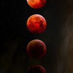 a group of red planets floating in the sky